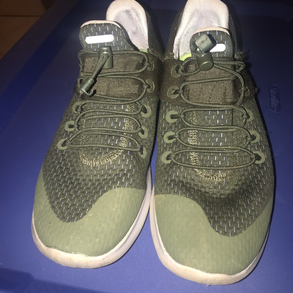 Green Nike running shoes